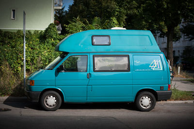 Blue vintage car on road