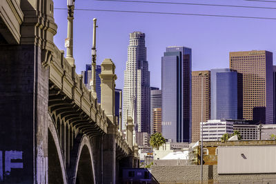 Modern buildings in city against sky