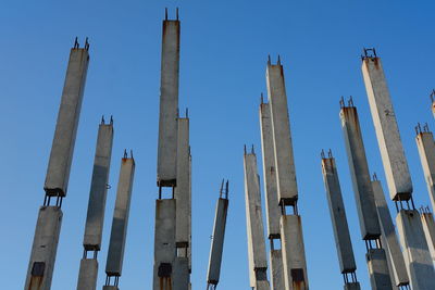 Low angle view of buildings against clear blue sky