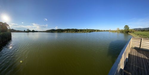 Scenic view of lake against blue sky