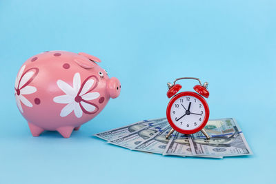 Close-up of clock against blue background