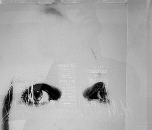 Woman standing by wall