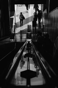 People walking on escalator