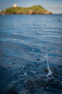 Close-up of water flowing over sea