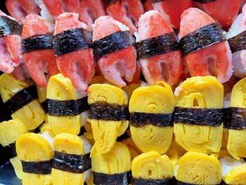 Full frame shot of fruits, sushi