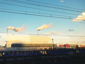 Low angle view of power lines against sky