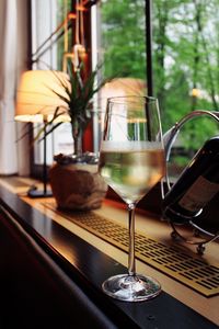 Close-up of wine in glass on table