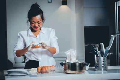 Woman holding food at home