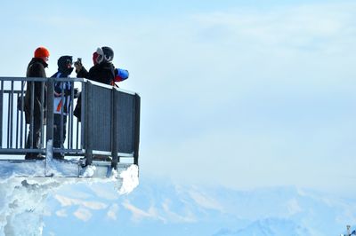 Low angle view of ski lift against sky