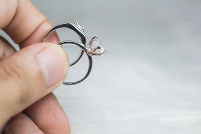 Close-up of hand holding ring