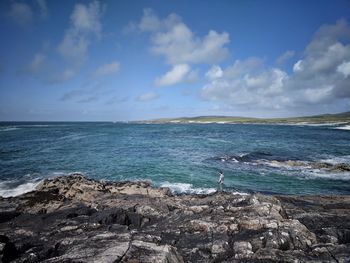 Scenic view of sea against blue sky