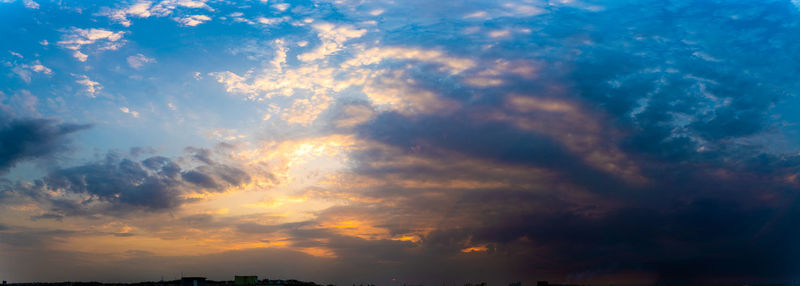 Low angle view of dramatic sky during sunset