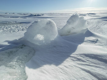 Aerial view of frozen sea against sky