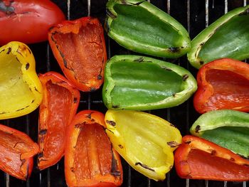 High angle view of colorful bell peppers on barbecue