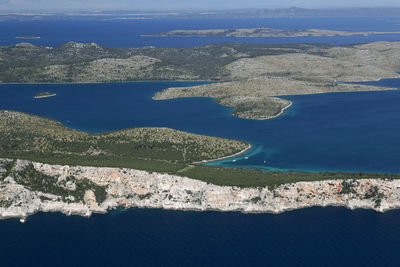 High angle view of sea shore against sky