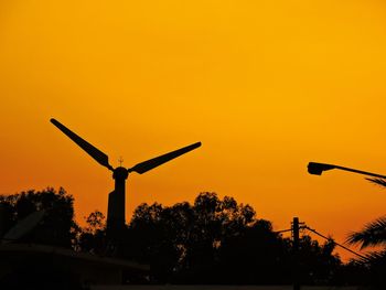 Low angle view of silhouette trees against sky during sunset