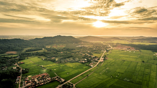 Aerial view of landscape against sky during sunset