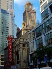 Low angle view of clock tower in city