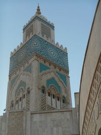 Low angle view of historic building against blue sky