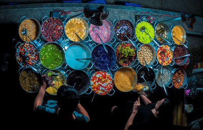 Directly above shot of people at market stall