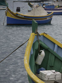 High angle view of fishing boats moored at harbor