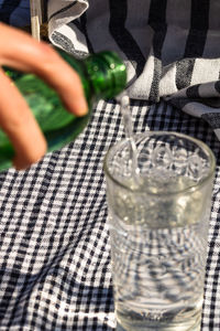 Close-up of hand holding drink