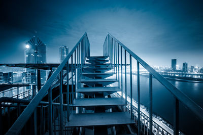 View of bridge and buildings against sky