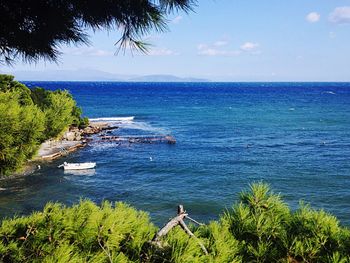 Scenic view of sea against blue sky