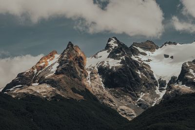 Panoramic view of snowcapped mountains against sky