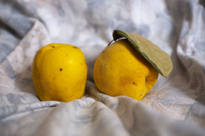 Close-up of yellow fruits on cutting board