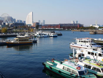 Boats moored at harbor