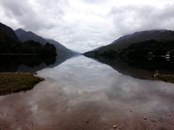 View of lake against cloudy sky