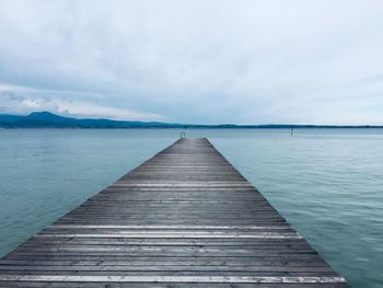 Pier over sea against sky