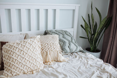 Bed in the bedroom with scandinavian style interior