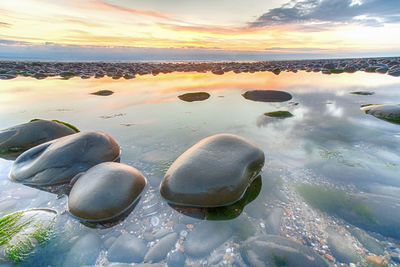 Scenic view of sea against sky during sunset