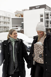 Female couple walking together at winter