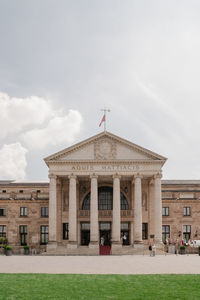 View of buildings against cloudy sky