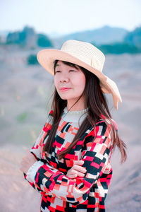 Portrait of a young woman wearing hat