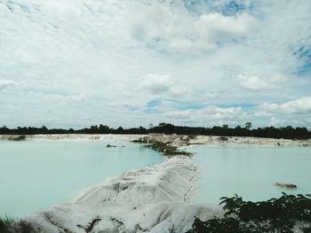 View of lake against cloudy sky