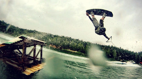 Woman jumping in water