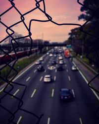 Road seen through chainlink fence