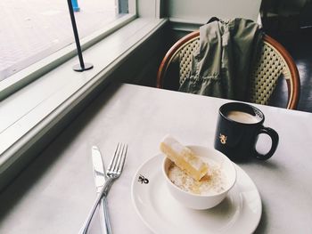 Close-up of cappuccino served on table