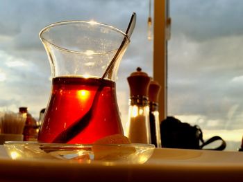 Close-up of wine glasses on table