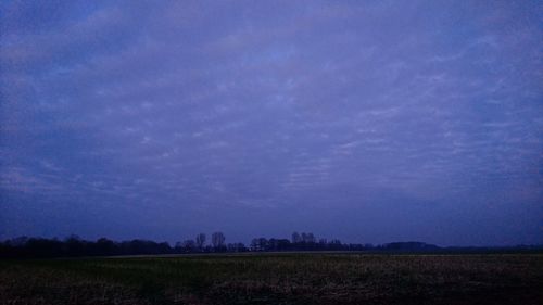 Scenic view of field against sky at night