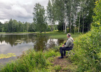 Rear view of man standing in forest