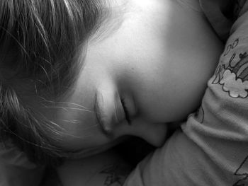 High angle view of woman lying on bed