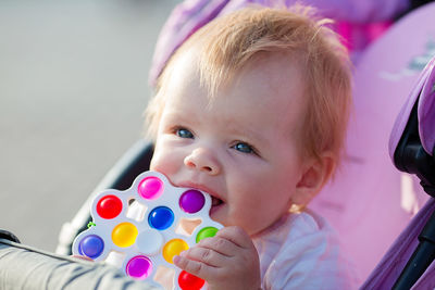 Portrait of cute baby girl looking away