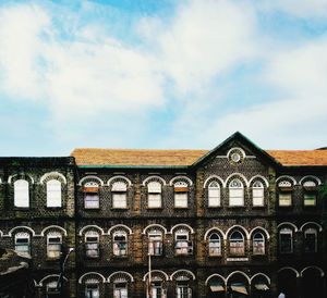 Building against cloudy sky