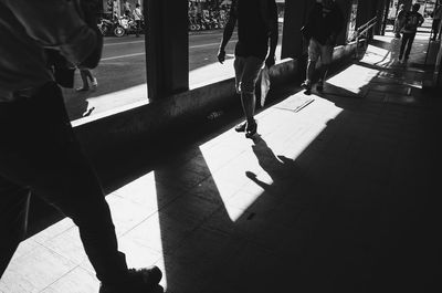 Low section of people standing on floor in city