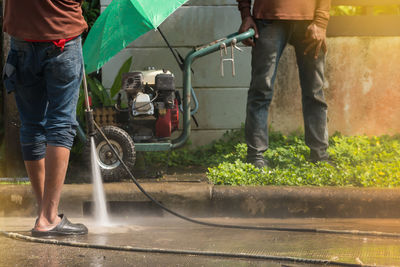 Low section of men working at yard